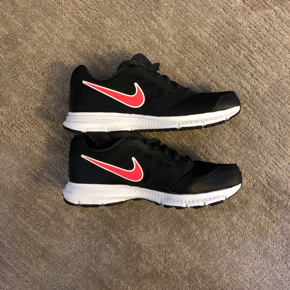 Black and pink women’s Nike shoes